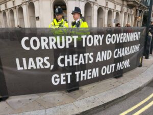banner outside Westminster: corrupt Tory government