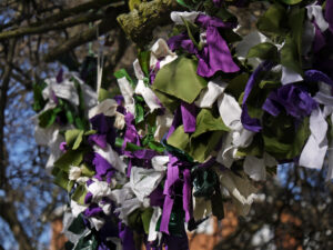 the Suffragettes' colours in ribbons