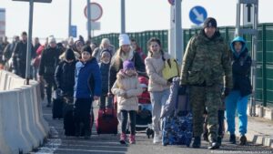 Ukrainian refugees crossing into Poland